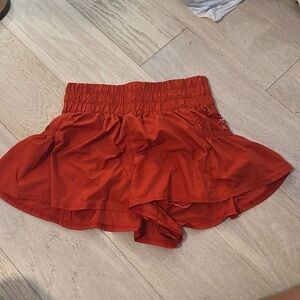 Red short flare athletic shorts